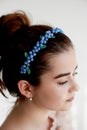 Portrait of beautiful girl with dark hair and light porcelain skin. Hair in a bun.Hair accessory handmade Royalty Free Stock Photo