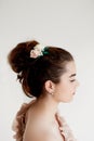 Portrait of beautiful girl with dark hair and light porcelain skin. Hair in a bun.Hair accessory handmade Royalty Free Stock Photo