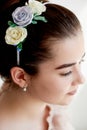 Portrait of beautiful girl with dark hair and light porcelain skin. Hair in a bun.Hair accessory handmade