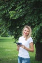 Portrait of a beautiful girl in denim shorts and a white T-shirt Royalty Free Stock Photo