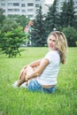 Portrait of a beautiful girl in denim shorts and a white T-shirt Royalty Free Stock Photo