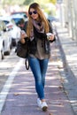 Portrait of beautiful girl drinking coffee and using her mobile Royalty Free Stock Photo