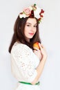 Portrait of beautiful girl with flower wreath holding apple Royalty Free Stock Photo