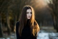 Portrait of a beautiful girl with flying hair in the wind. Young sad woman. Portrait of lonely woman Royalty Free Stock Photo