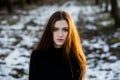 Portrait of a beautiful girl with flying hair in the wind. Young sad woman. Portrait of lonely woman Royalty Free Stock Photo