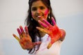 Portrait of a beautiful girl full of colored powder all over the body. Young girl plays with colors on the occasion of Holi. Royalty Free Stock Photo