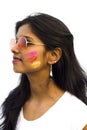 Portrait of a beautiful girl full of colored powder all over the body. Young girl plays with colors on the occasion of Holi. Royalty Free Stock Photo