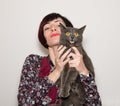 Portrait of beautiful girl with funny chartreux cat