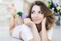 Portrait of a beautiful girl gentle, cute young, lying on the floor, with laptop posing Royalty Free Stock Photo