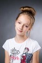 Portrait of a beautiful girl on a gray background