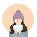 Portrait of a beautiful girl in a hat on her eyes with a snow heart in her hands. Emotional facial expressions, love, kiss. Flat Royalty Free Stock Photo