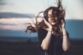 Portrait of a beautiful girl in headphones listening to music on nature Royalty Free Stock Photo