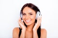 Portrait of beautiful girl listening music in white headphones Royalty Free Stock Photo