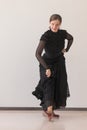 Portrait of beautiful girl in a long black dress dancing flamenco Royalty Free Stock Photo