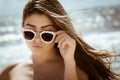 Portrait of a beautiful girl with long hair and sunglasses Royalty Free Stock Photo