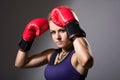 Portrait of beautiful girl with red boxing gloves, aggressive an Royalty Free Stock Photo
