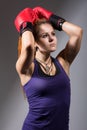 Portrait of beautiful girl with red boxing gloves, looking up Royalty Free Stock Photo