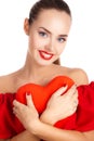 Portrait of beautiful girl with red heart