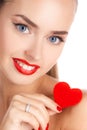 Portrait of beautiful girl with red heart