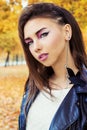 Portrait of a beautiful girl in rock style with bright makeup