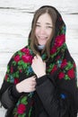 Portrait of a beautiful girl in a Russian headscarf. Young woman