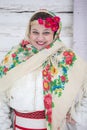 Portrait of a beautiful girl in a Russian headscarf. Young woman . Russian village in winter Royalty Free Stock Photo