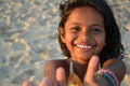 Portrait of a beautiful girl showing thumbs up