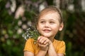 Portrait of a beautiful girl with a bouquet of forget-me-nots