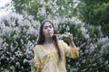 Beautiful teenager girl and soap bubbles.