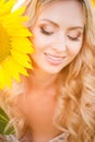 Portrait of the beautiful girl with a sunflowers Royalty Free Stock Photo