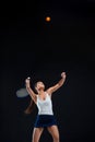 Portrait of beautiful girl tennis player with a racket on dark background Royalty Free Stock Photo