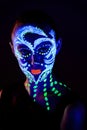 Girl with neon make-up in color light Royalty Free Stock Photo