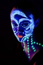 Girl with neon make-up in color light Royalty Free Stock Photo