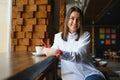 Portrait of beautiful girl using her mobile phone in cafe Royalty Free Stock Photo