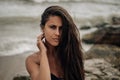 Portrait of a girl with waves in the background