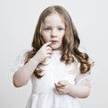 Portrait of a beautiful girl in a white dress