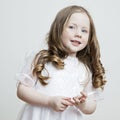 Portrait of a beautiful girl in a white dress