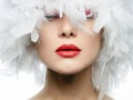 Portrait of Beautiful Girl in white feathers Royalty Free Stock Photo