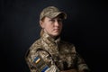 Portrait Of Beautiful Girl With Yellow And Blue Ukrainian Flag On Her Cheek Wearing Military Uniform. Ukrainian Women In The Army
