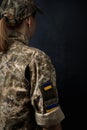 Portrait Of Beautiful Girl With Yellow And Blue Ukrainian Flag On Her Cheek Wearing Military Uniform. Ukrainian Women In The Army