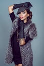 Portrait of a beautiful glam model wearing silver fox jacket Royalty Free Stock Photo