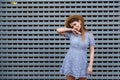 Portrait of a beautiful graceful woman in elegant hat and blue lace dress. Beauty, fashion concept. Royalty Free Stock Photo