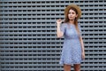 Portrait of a beautiful graceful woman in elegant hat and blue lace dress. Beauty, fashion concept Royalty Free Stock Photo