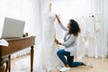 Portrait beautiful happy African American designer taking measurements on mannequin in her studio. Fashion small business Royalty Free Stock Photo