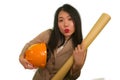 Portrait of beautiful and happy Asian Korean woman with hardhat holding building blueprints as architect engineer or constructor Royalty Free Stock Photo