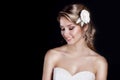 Portrait of beautiful happy gentle women bride in a white wedding dress c beautiful salon wedding hair with white flowers in her Royalty Free Stock Photo