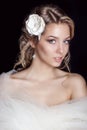 Portrait of beautiful happy gentle women bride in a white wedding dress c beautiful salon wedding hair with white flowers in her Royalty Free Stock Photo