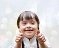 Portrait of the beautiful happy girl giving thumbs up Royalty Free Stock Photo