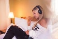 Portrait of beautiful happy girl with headphones listening to pop music. Royalty Free Stock Photo