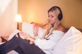 Portrait of beautiful happy girl with headphones listening to rock music. Royalty Free Stock Photo